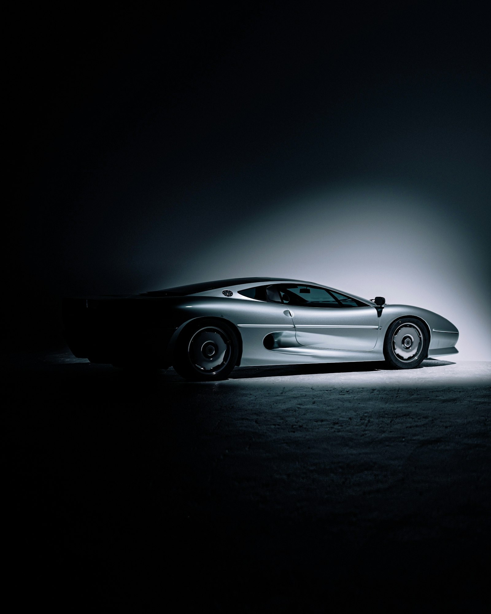 Premium electric vehicle under dramatic studio lighting